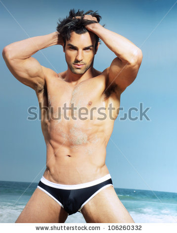 stock-photo-sexy-man-posing-against-summer-background-106260332