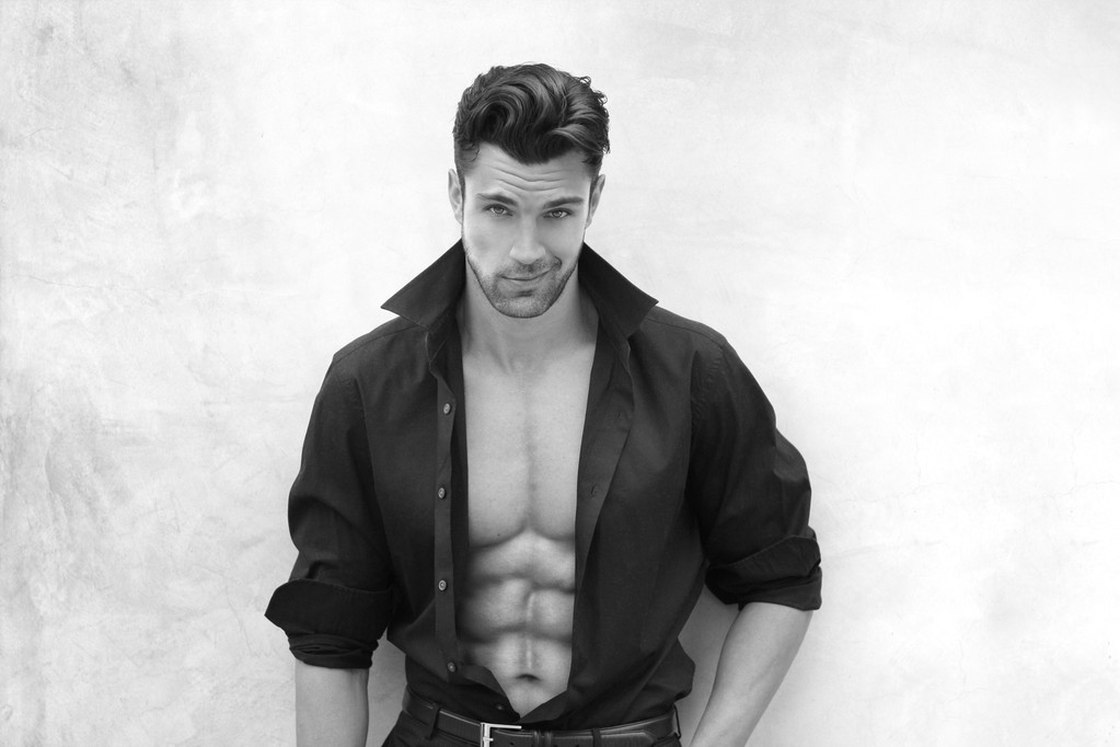 Handsome muscular male stripper with a cheeky grin - Hire Male Strippers in Vegas 